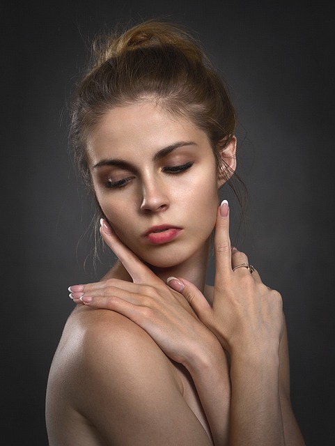 a woman with her hands on her face